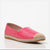 A single women's espadrille flat shoe in bright pink crocodile-embossed leather with a natural jute-wrapped midsole and a beige rubber toe cap, shown on a white reflective studio background.