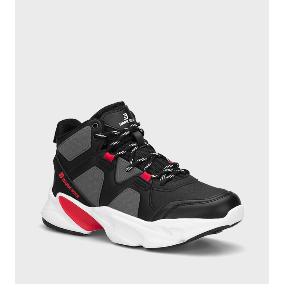 A black and gray mid-top athletic sneaker with white and red accents, featuring a chunky white sole and black-and-white laces, shown against a light gray background.