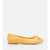 A single yellow suede ballet flat shoe with a small bow detail on the toe, shown in profile against a plain white background.