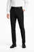 Person wearing a white dress shirt, black pants, and black shoes on a white background