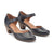 Pair of black high-heeled shoes with brown soles on a white background