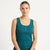 A woman wearing a teal ribbed scoop-neck tank top with a three-button henley neckline, photographed against a clean white studio background.