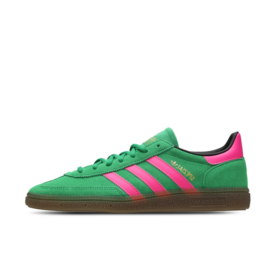 Green and pink Adidas sneaker on a white background