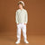 A young boy modeling a light green and white striped long-sleeve polo shirt, white pants, and white sneakers against a solid brown studio background.