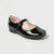 A single black patent leather Mary Jane shoe with a low heel, shown from a three-quarters angle on a light gray background.