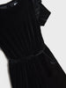 Black velvet dress with ruffled sleeves on a white background