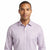 A man wearing a light purple long-sleeve button-down shirt with a subtle geometric pattern, photographed against a solid white background.