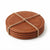 A stack of five round brown leather coasters bound together with a natural jute twine rope, shown on a clean white background.