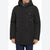 A man wearing a black hooded winter parka with a front zipper, four buttoned flap pockets, and a high collar, paired with blue jeans against a plain white background.