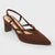 A single dark brown suede slingback pump with a pointed toe, criss-cross ankle straps, and a chunky block heel, shown on a light gray background.