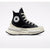 A Converse high-top sneaker in black canvas with a thick cream-colored platform sole, white laces, and the signature circular Converse logo patch on the side.