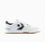 White sneaker with black star logo on a white background