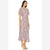 A woman modeling a light purple midi dress with a dense multicolor floral print, featuring short flutter sleeves and a ruffled hem, set against a plain white background.