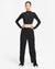 Person wearing a black Nike outfit on a white background