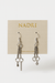 Pair of silver earrings on a NADRI branded card against a white background