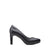 A single black leather high-heeled pump with a pointed toe and a slim block heel, shown in profile against a solid white background.