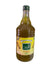 Hand holding a bottle with a yellow label featuring branding, against a cluttered background.