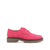 A single women's oxford shoe in bright pink suede with brogue detailing and a chunky brown lug sole, shown in profile against a plain white background.