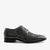 Black Adidas sneaker on a light gray background
