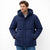 Man wearing a blue puffer jacket on a white background