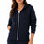 A woman wearing a navy blue zip-up hoodie with a white zipper and matching navy sweatpants, shown from the neck down against a plain white background.