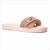 A single Michael Kors slide sandal in a light blush pink color, featuring a textured woven strap with a gold-tone MK logo buckle, set against a plain white background.