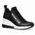 A black slip-on sneaker with a white midsole and a prominent white 'MICHAEL KORS' logo on the side, shown against a plain white background.