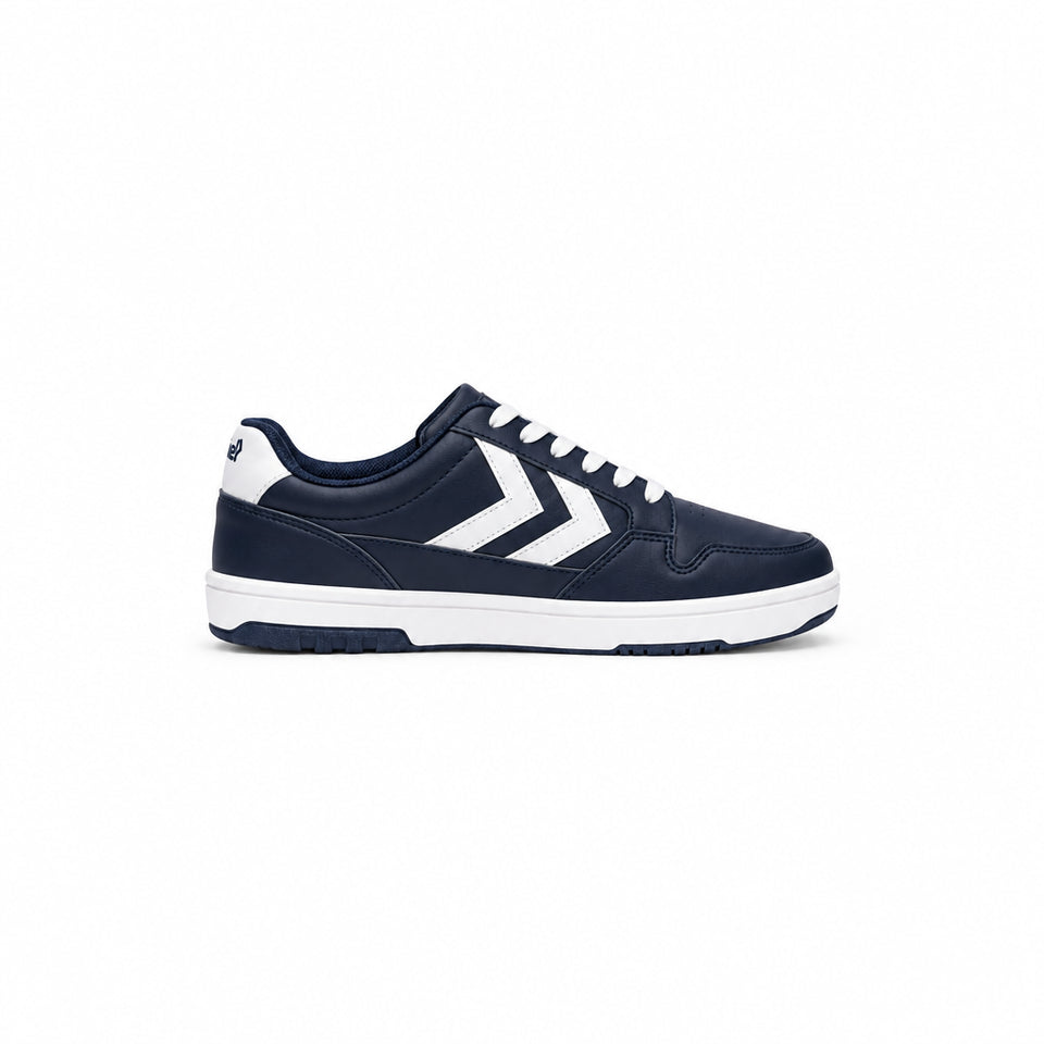A navy blue and white low-top sneaker shown from a side profile view against a plain white background. The shoe features a navy blue leather upper with a prominent white chevron logo on the side, white laces, and a thick white midsole.