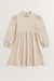 Beige dress with long sleeves on a light gray background