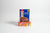 DOMO custard powder packaging on a wooden surface