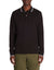Man wearing a black long-sleeve polo shirt with white trim on a white background