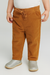 Child wearing brown corduroy pants and silver shoes on a white background