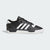 Black and white Adidas sneaker on a light gray background