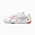 A white Puma Scuderia Ferrari racing shoe with red and black accents, featuring the Ferrari shield logo on the heel, shown against a light gray background.
