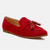 Red loafer shoe with a bow on a white background