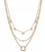 Layered gold necklaces with various links on a white background