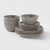 Set of gray ceramic bowls and plates on a white background