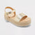 Gold platform sandal on a light gray background