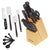 Knife set with a wooden block, spatulas, and measuring spoons on a white background
