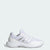 A white Adidas athletic shoe with metallic silver stripes, shown from a side profile on a light gray background.