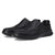 Black soccer cleats with brown accents on a white background