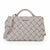 A light gray woven leather handbag with a top handle, adjustable shoulder strap, and gold-tone hardware, shown on a plain white background.