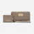 Bebe Los Angeles taupe quilted wallet set with a matching card holder and wristlet strap, featuring gold-tone hardware and logo plates, on a white background.