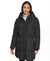 A woman wearing a black hooded puffer coat with horizontal quilting, front zipper, and zippered hand pockets, photographed against a plain white studio background.
