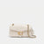 A light cream quilted leather shoulder bag with a gold-tone C-shaped turn-lock closure and a gold chain strap, shown against a plain light gray background.