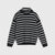 A black and white horizontally striped knit mock neck sweater with long sleeves, displayed flat against a light gray background.