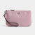 A pink textured canvas wristlet clutch with a silver-tone metal 'C' logo on the front, a matching pink leather wrist strap with a black cord, and a silver-tone zipper closure, shown against a plain light gray background.