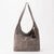 A taupe brown suede hobo shoulder bag with a long strap and a decorative tassel charm featuring black, brown, and beige elements, shown against a plain white background.