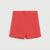 A pair of coral red waffle-knit shorts laid flat against a light gray background.