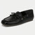 Black sandal with flower detail on a white background